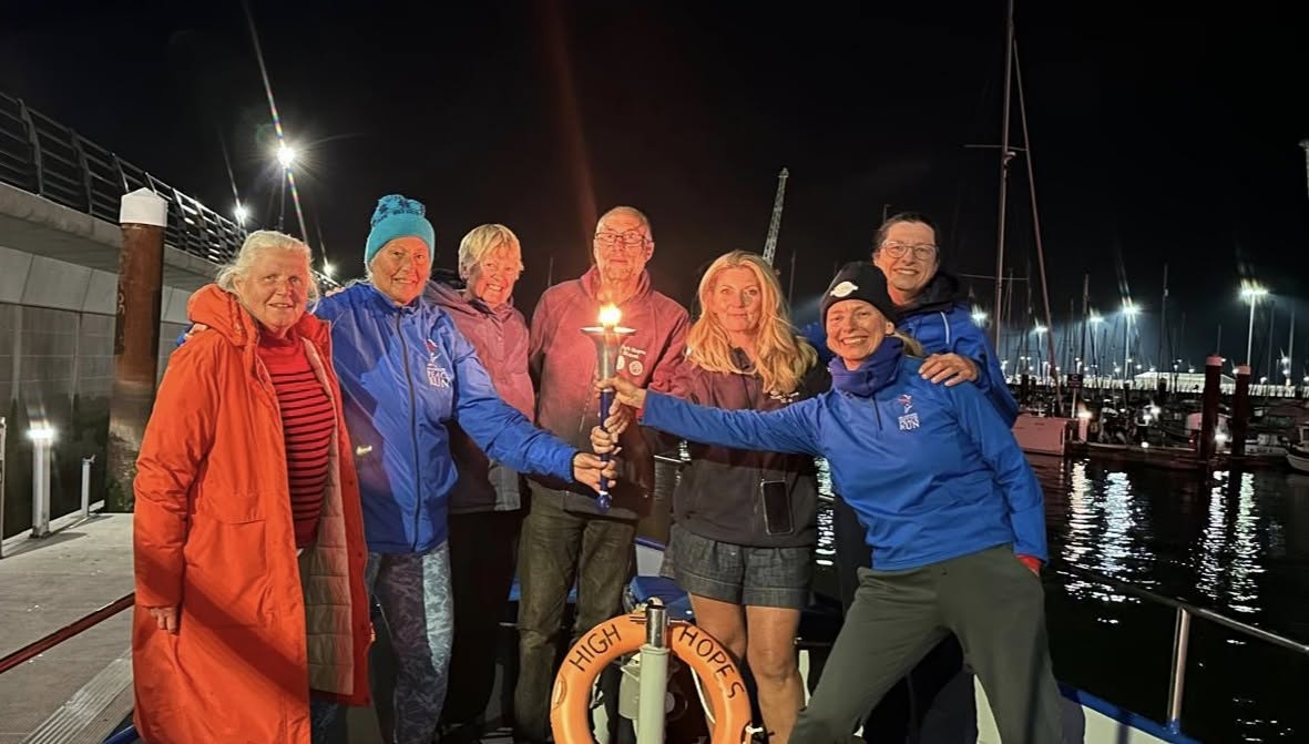 Sharing the Peace torch with the boat pilots and observer