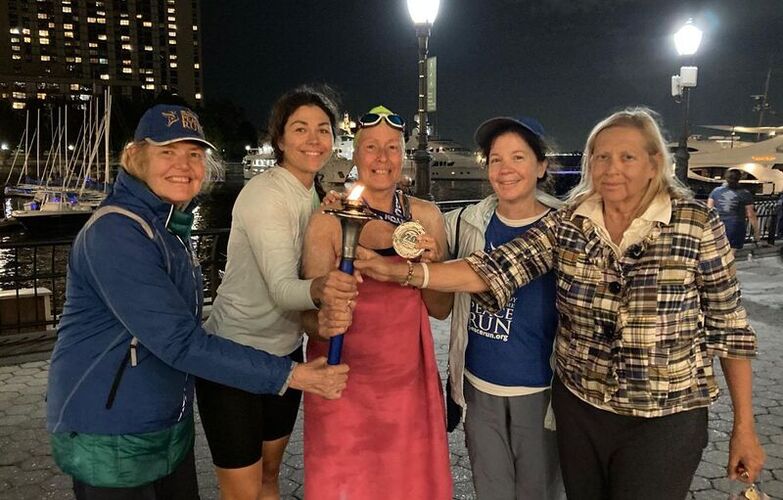 Sharing the Peace Torch with kayaker Dasha and helpers Jamini and Pipasa